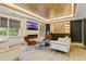 Finished basement area with a modern fireplace and a stylish bar area at 121 Fairway Overlook, Woodstock, GA 30188