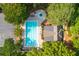 Aerial view of a community pool, clubhouse, and parking surrounded by lush trees at 210 Hunters Vw, Roswell, GA 30075
