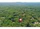 Property location highlighted in an aerial view surrounded by lush greenery at 210 Hunters Vw, Roswell, GA 30075