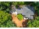 An aerial view of the house with a lush backyard at 210 Hunters Vw, Roswell, GA 30075