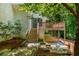 The backyard features a tiered deck and stone patio, ideal for outdoor living and entertaining at 210 Hunters Vw, Roswell, GA 30075
