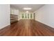 Spacious finished basement with hardwood flooring and multiple windows offering natural light at 210 Hunters Vw, Roswell, GA 30075