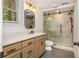 Updated bathroom featuring a quartz countertop, modern vanity, and a glass-enclosed walk-in shower at 210 Hunters Vw, Roswell, GA 30075