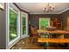 Elegant dining room with natural light, stylish decor, and a custom wood table with bench seating at 210 Hunters Vw, Roswell, GA 30075
