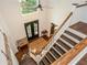 Bright entryway boasts hardwood floors, statement front door, and high ceilings with a large window at 210 Hunters Vw, Roswell, GA 30075