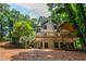 Home with a covered porch and outdoor chandelier at 210 Hunters Vw, Roswell, GA 30075