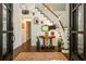 Welcoming foyer featuring hardwood floors, staircase, and elegant decor at 210 Hunters Vw, Roswell, GA 30075