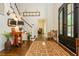 Elegant foyer with hardwood floors, staircase, and stylish decor at 210 Hunters Vw, Roswell, GA 30075
