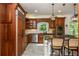 Gourmet kitchen with stainless appliances, granite counters, and custom cabinets in a modern home at 210 Hunters Vw, Roswell, GA 30075