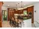 Spacious kitchen featuring an island with barstool seating, custom cabinets, and updated appliances at 210 Hunters Vw, Roswell, GA 30075