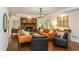 Inviting living room with stone fireplace, hardwood floors, and comfortable seating at 210 Hunters Vw, Roswell, GA 30075
