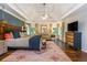 Spacious main bedroom boasting tray ceilings, hardwood floors, and lots of natural light at 210 Hunters Vw, Roswell, GA 30075