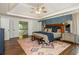 Spacious main bedroom featuring trey ceilings, wooden floors, stylish decor, and lots of natural light at 210 Hunters Vw, Roswell, GA 30075