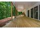 Large porch overlooking a wooded area with lots of shade and steps leading to higher elevation at 210 Hunters Vw, Roswell, GA 30075