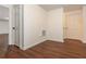 Bright room with hardwood flooring and white walls, doors leading to other rooms in the house at 210 Hunters Vw, Roswell, GA 30075