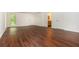 Bright room with hardwood flooring, white walls, large windows and doors leading to other rooms in the house at 210 Hunters Vw, Roswell, GA 30075
