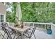 Back deck with outdoor table, chairs, and umbrella perfect for outdoor relaxation and dining at 3158 Crestmont Nw Way, Kennesaw, GA 30152