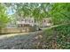 Expansive backyard featuring a two-story deck and a charming white picket fence at 3158 Crestmont Nw Way, Kennesaw, GA 30152