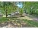 Spacious backyard with well-maintained lawn and classic white picket fence bordering the property at 3158 Crestmont Nw Way, Kennesaw, GA 30152