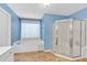Well lit bathroom with separate glass shower and soaking tub with window at 3158 Crestmont Nw Way, Kennesaw, GA 30152