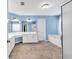 An aqua painted bathroom featuring double sink vanity, tile floor, tub and shower at 3158 Crestmont Nw Way, Kennesaw, GA 30152