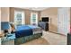 Bedroom with neutral carpet, ceiling fan, two windows and plenty of natural light at 3158 Crestmont Nw Way, Kennesaw, GA 30152