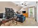 Upstairs bonus room with ceiling fan, desk, television and comfortable seating at 3158 Crestmont Nw Way, Kennesaw, GA 30152