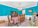 The open concept dining room has an ornate light fixture and is surrounded by boxes and packing materials at 3158 Crestmont Nw Way, Kennesaw, GA 30152