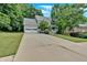 Lovely home with an attached two-car garage and a long driveway, surrounded by green trees at 3158 Crestmont Nw Way, Kennesaw, GA 30152
