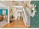 Grand two-story foyer with hardwood floors and a staircase leading to the upper level at 3158 Crestmont Nw Way, Kennesaw, GA 30152