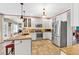 Open concept kitchen features granite counters, an island with seating and modern, stainless steel appliances at 3158 Crestmont Nw Way, Kennesaw, GA 30152