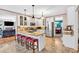 Bright kitchen with granite countertops, an island with seating, and stainless steel appliances at 3158 Crestmont Nw Way, Kennesaw, GA 30152