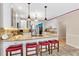 Modern kitchen features a granite countertop island with seating, stainless steel appliances, and white cabinets at 3158 Crestmont Nw Way, Kennesaw, GA 30152
