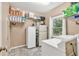 Functional laundry room is equipped with shelving, washer, dryer and additional freezer at 3158 Crestmont Nw Way, Kennesaw, GA 30152