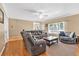 Spacious living room with hardwood floors, comfortable seating, and natural light from large windows at 3158 Crestmont Nw Way, Kennesaw, GA 30152