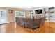 Cozy living room features a large sofa, built-in bookshelves, fireplace, and hardwood floors at 3158 Crestmont Nw Way, Kennesaw, GA 30152