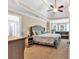 Spacious bedroom with a ceiling fan, sitting area and large windows providing natural light at 3158 Crestmont Nw Way, Kennesaw, GA 30152