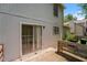 A backyard deck with a sliding glass door and railing showcasing an outdoor living space at 5107 Rails Way, Norcross, GA 30071
