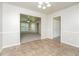 Dining area featuring tile floors and an open view into a spacious living room at 5107 Rails Way, Norcross, GA 30071