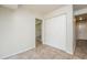 Hallway featuring tile floors and a closet for extra storage at 5107 Rails Way, Norcross, GA 30071