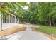 Expansive backyard featuring a pool, patio, and lush greenery, ideal for outdoor entertaining and relaxation at 6394 Wood Valley Rd, Douglasville, GA 30134