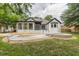 Gorgeous backyard with a pool, patio, and screened-in porch, perfect for entertaining and enjoying the outdoors at 6394 Wood Valley Rd, Douglasville, GA 30134
