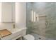 Bathroom featuring a modern sink, stylish vanity, a glass-enclosed shower with a rain shower head at 6394 Wood Valley Rd, Douglasville, GA 30134