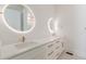 Bright bathroom with double vanity, quartz countertop, modern backlit mirrors, and gold hardware at 6394 Wood Valley Rd, Douglasville, GA 30134