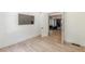 Bright bedroom featuring light wood floors, white trim, and access to other rooms at 6394 Wood Valley Rd, Douglasville, GA 30134