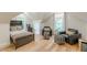 Cozy bedroom featuring hardwood floors, natural light, and comfortable furnishings at 6394 Wood Valley Rd, Douglasville, GA 30134