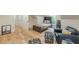 Bright bonus room with hardwood floors, and stylish furniture at 6394 Wood Valley Rd, Douglasville, GA 30134