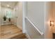 Bright hallway featuring hardwood floors, white trim, and natural light from a window at 6394 Wood Valley Rd, Douglasville, GA 30134