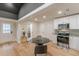 Bright kitchen featuring white cabinets, stainless steel appliances, granite countertops, and adjoining dining area at 6394 Wood Valley Rd, Douglasville, GA 30134