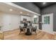 Modern kitchen featuring stainless steel appliances, white cabinets, and granite counters near dining area at 6394 Wood Valley Rd, Douglasville, GA 30134